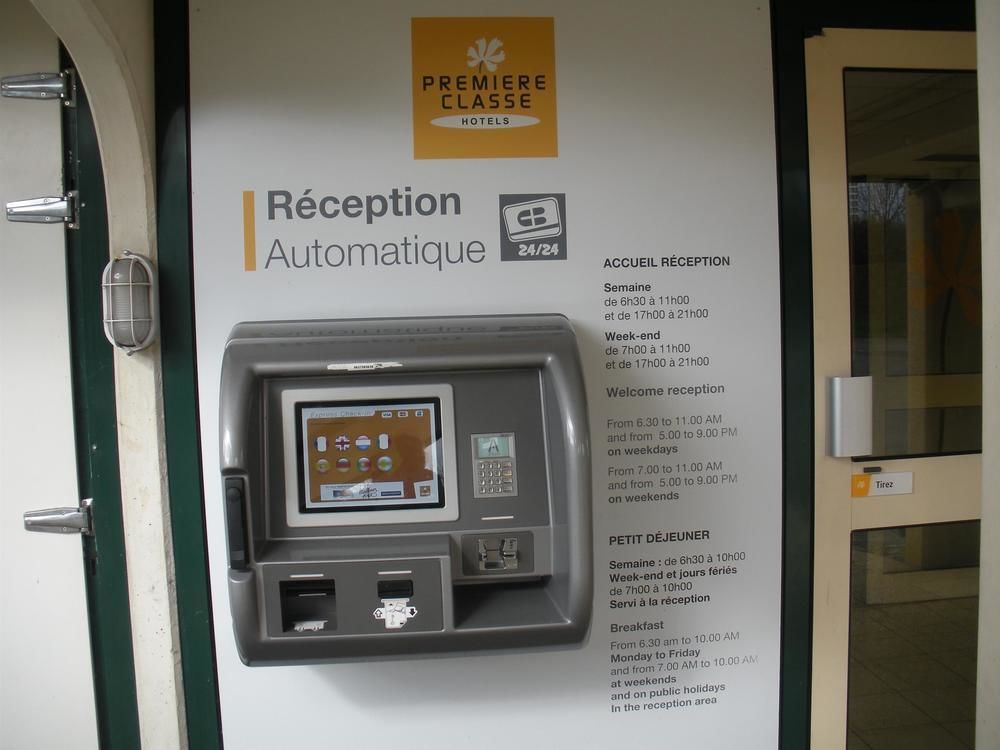 Premiere Classe Evreux Exterior photo An automated hotel check-in machine