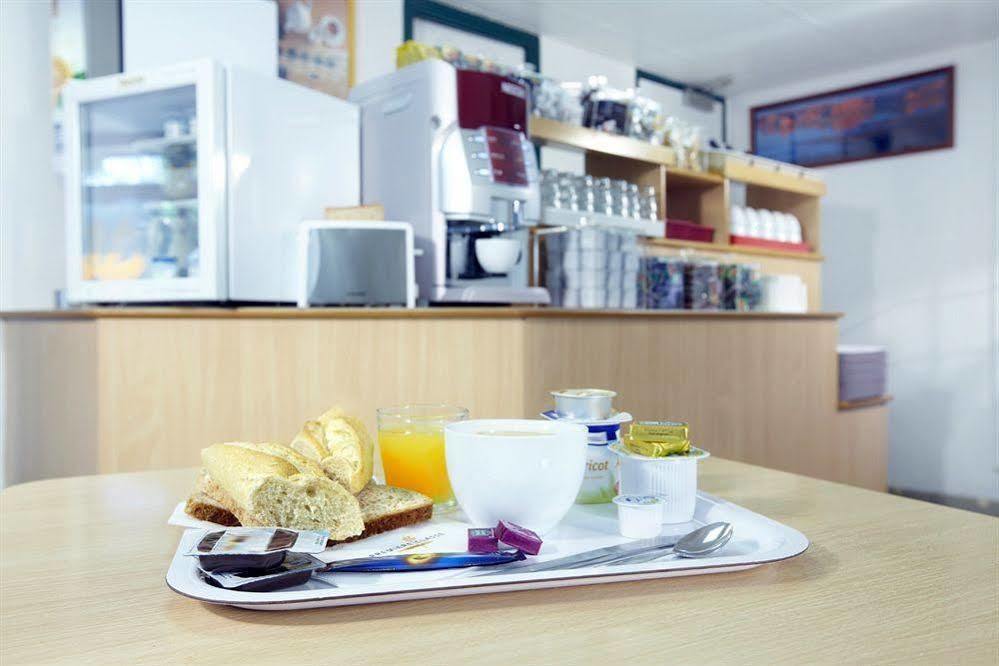 Premiere Classe Evreux Exterior photo A typical breakfast at a German hotel