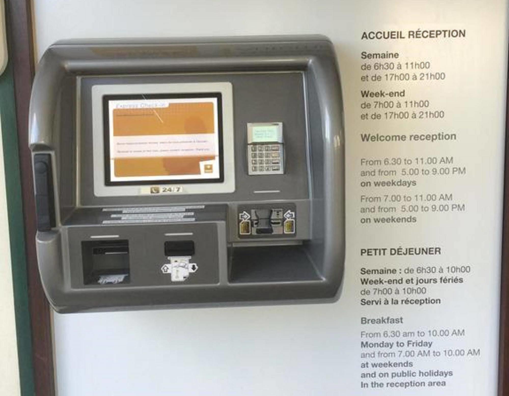 Premiere Classe Evreux Exterior photo A self-service kiosk at the reception area of a hotel